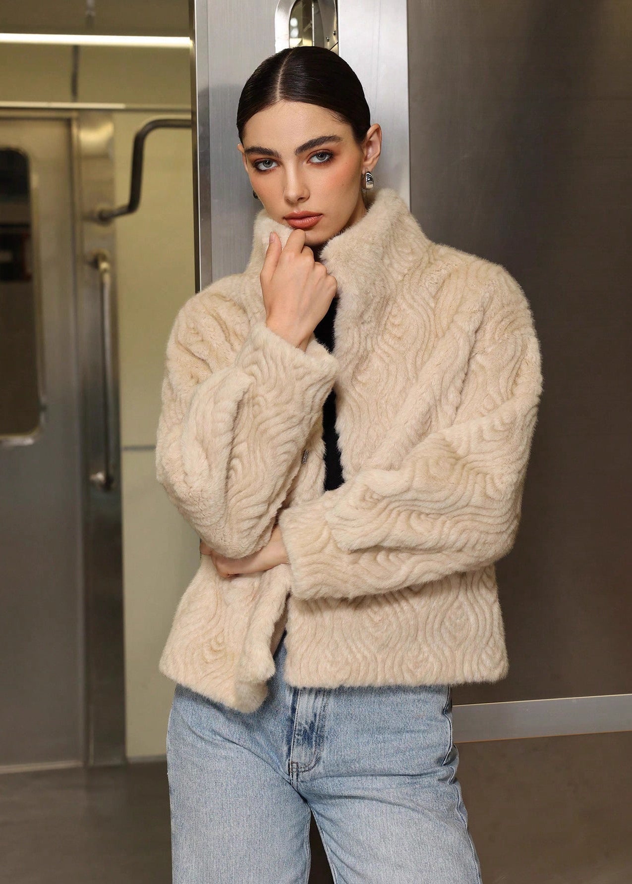 Manteau épais col montant femme